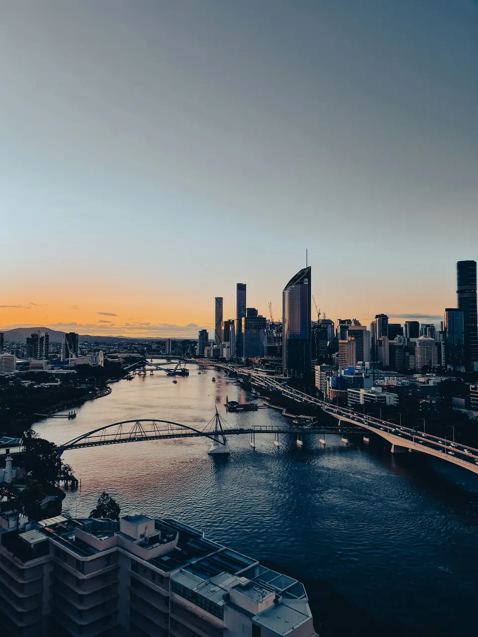 Brisbane River winding past the city at dusk